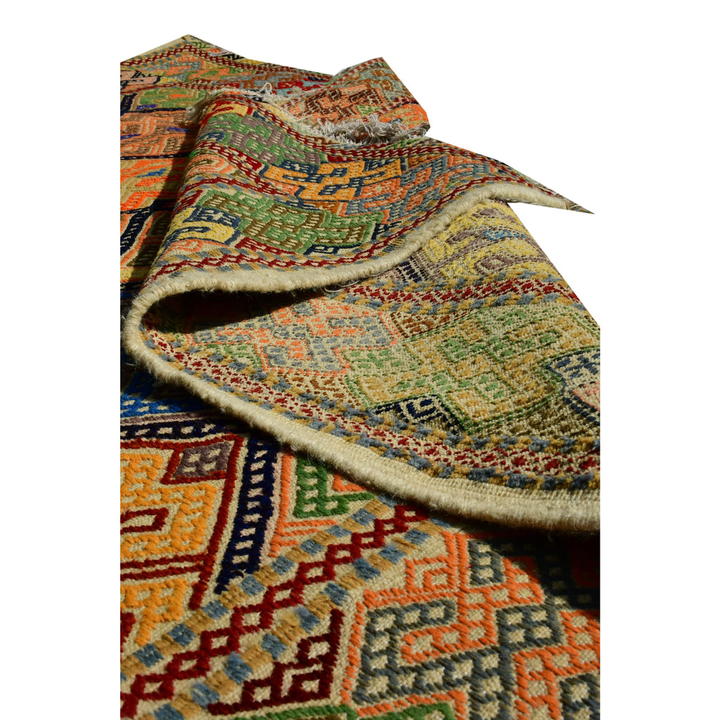 Handmade Afghan Aqcha Wool Rug 6x10 ft folded view displaying geometric pattern continuity