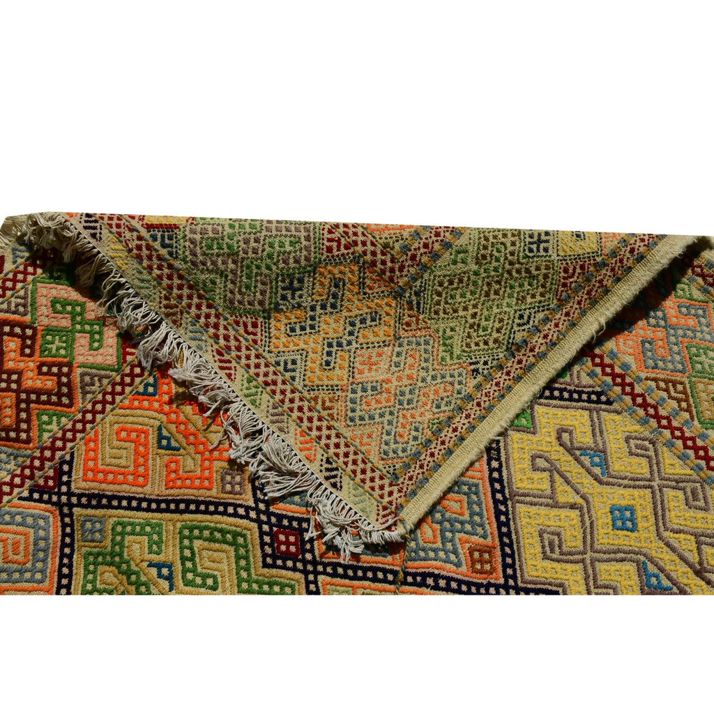 Handmade Afghan Aqcha Wool Rug 6x10 ft partially rolled showing thickness and flatweave