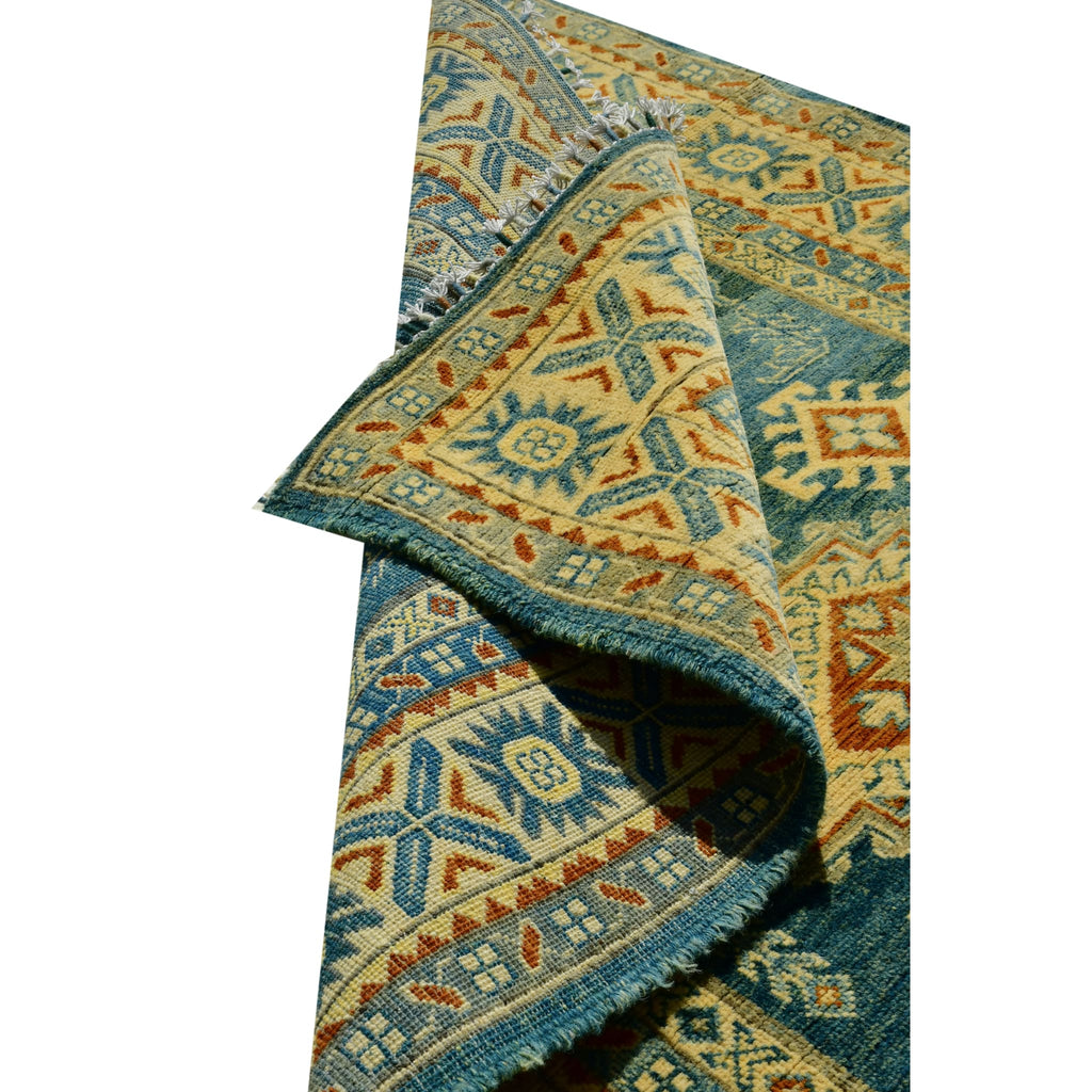 Handmade Afghan Aqcha Wool Rug 4x6 ft partially rolled view showing wool thickness and pile