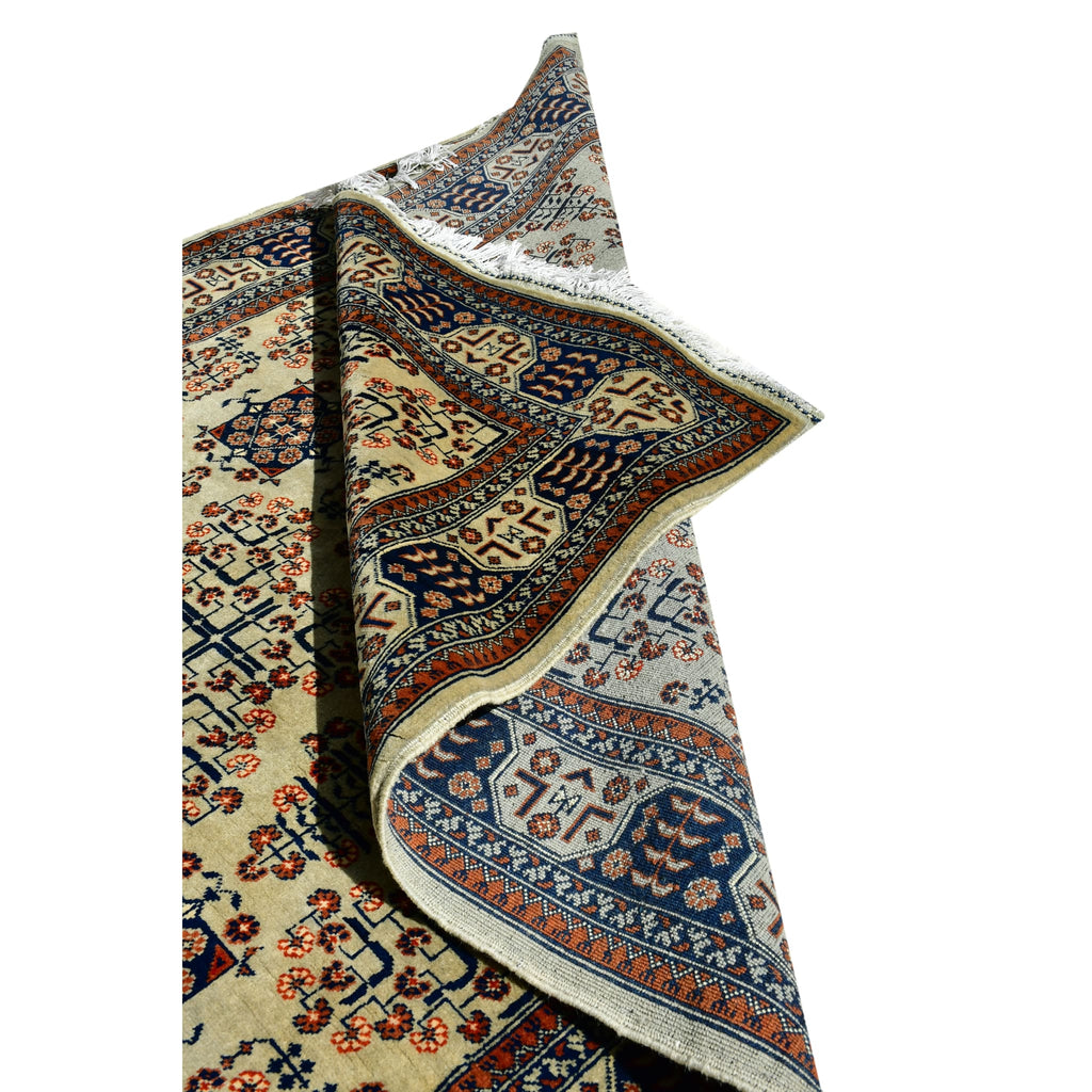 Handmade Afghan Aqcha Wool Rug 5x7 ft partially rolled showing thickness and weave density