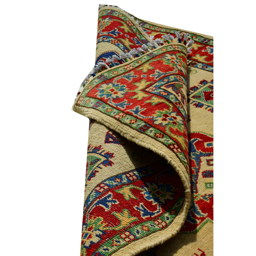 Handmade Afghan Aqcha Wool Rug 3x5 ft partially rolled view showing wool thickness and pile