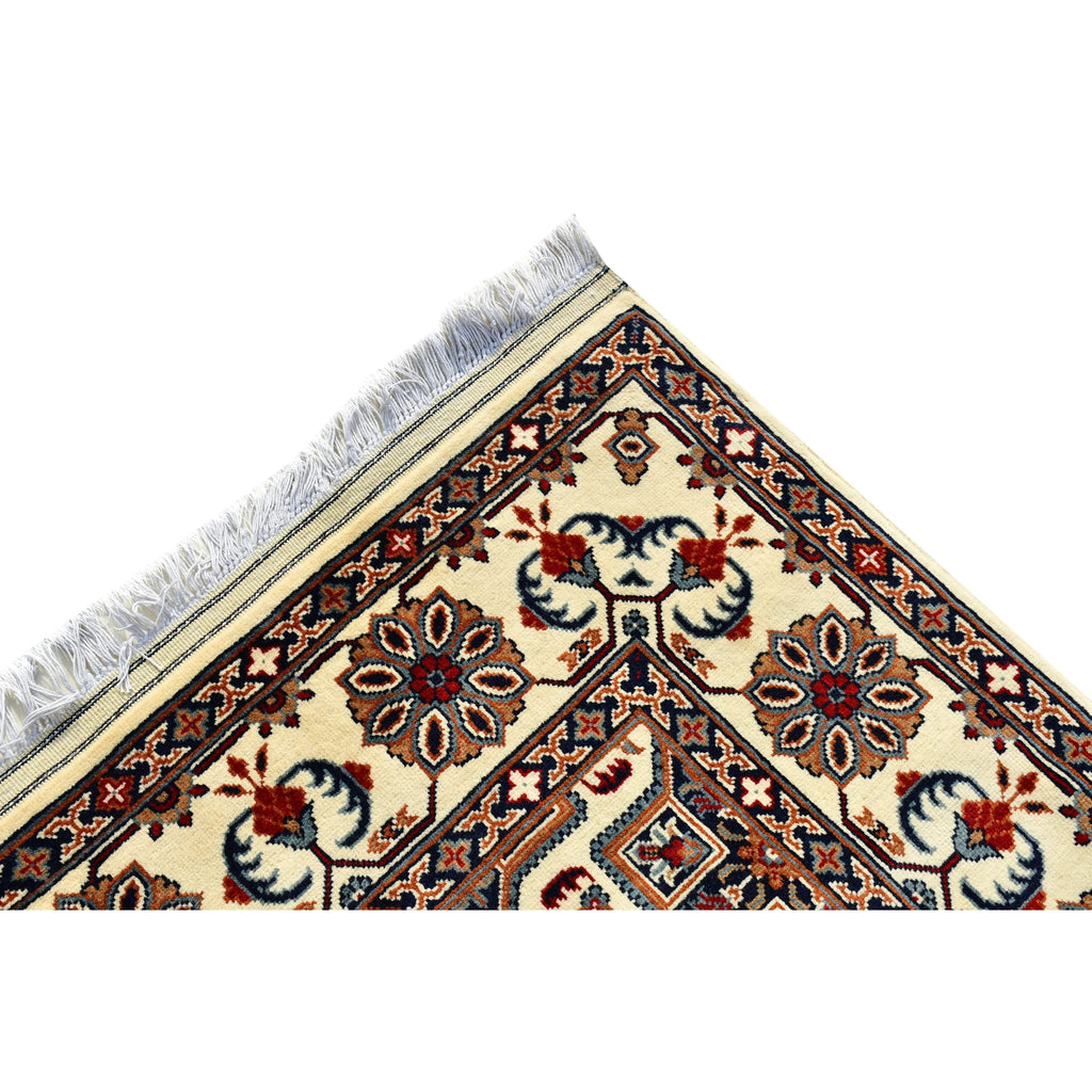 Handmade Afghan Aqcha Wool Rug 5x7 ft corner detail showing floral border and fringe