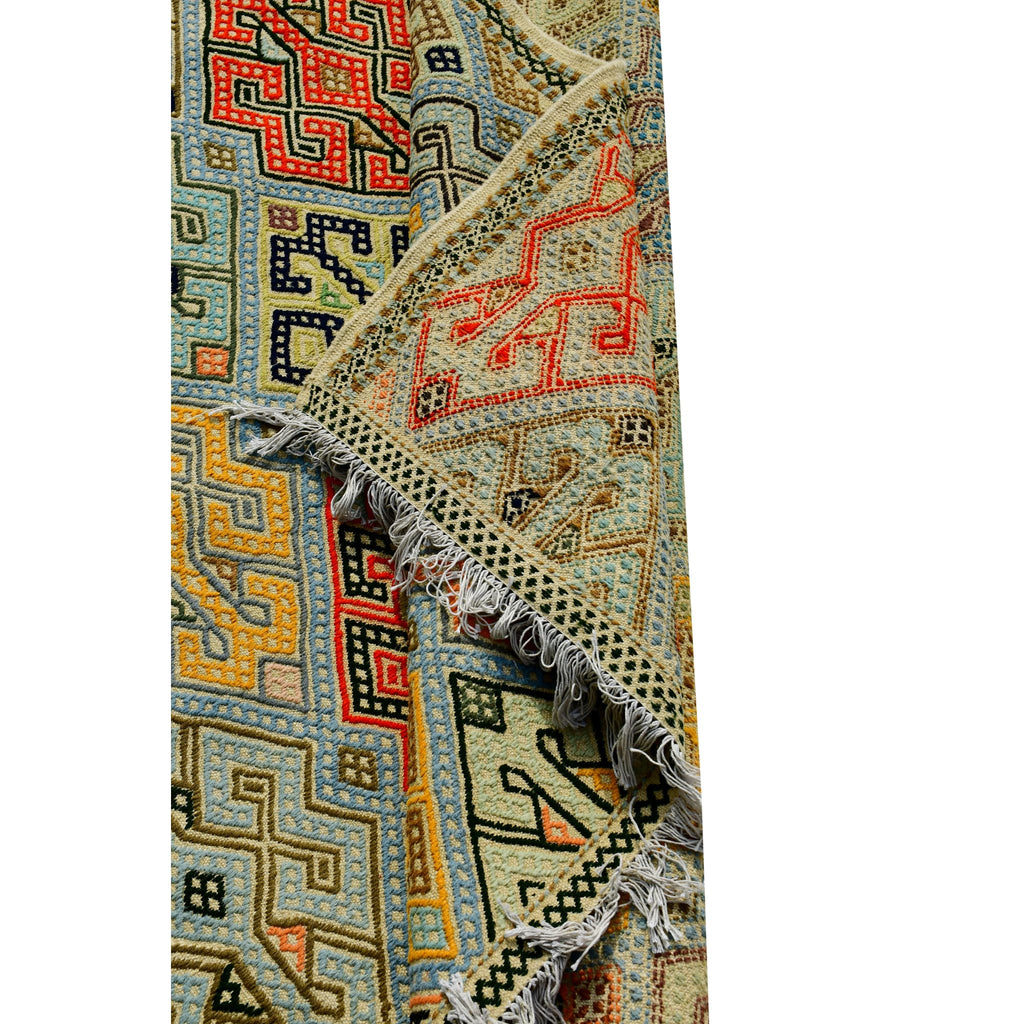 Handmade Afghan Aqcha Wool Rug 7x10 ft rolled view highlighting fringe and edge