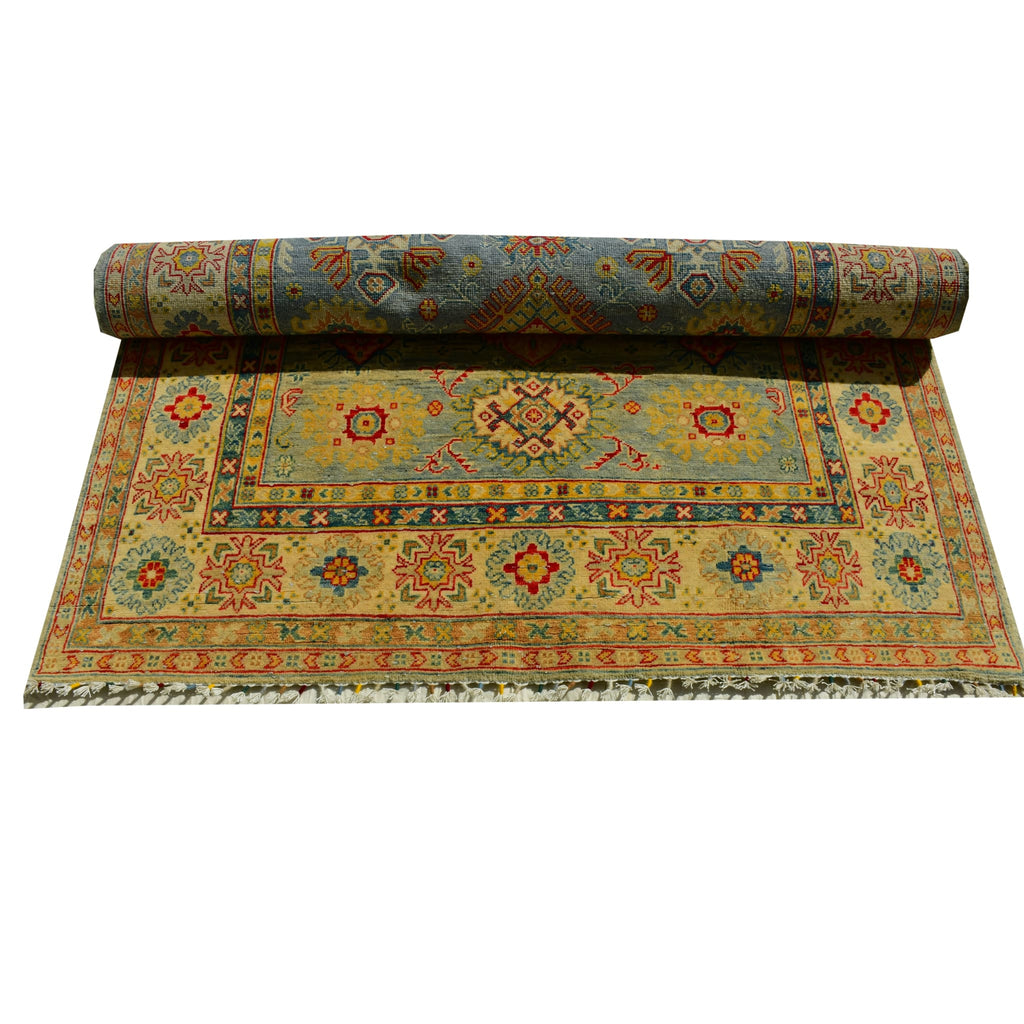 Handmade Afghan Aqcha Wool Rug 5x8 ft fully rolled view highlighting Kazakh pattern continuity