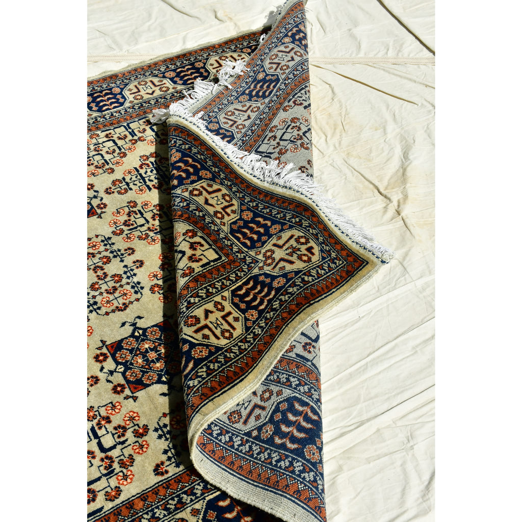Handmade Afghan Aqcha Wool Rug 5x7 ft tilted view emphasizing pattern clarity and vegetable dye colors
