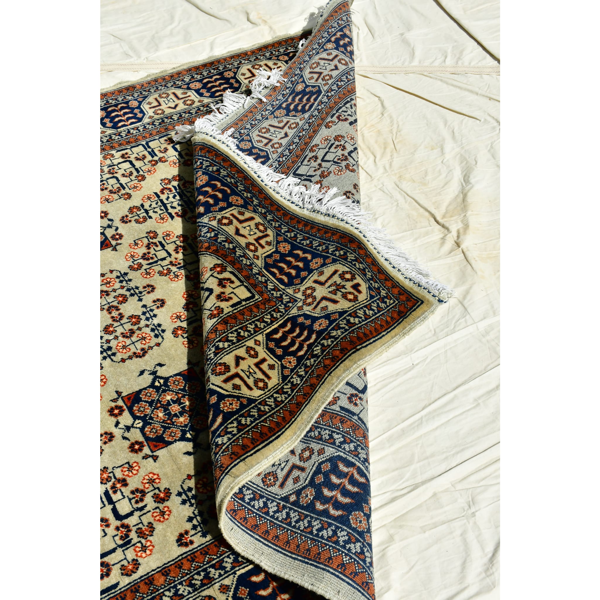 Handmade Afghan Aqcha Wool Rug 5x7 ft tilted view emphasizing pattern clarity and vegetable dye colors