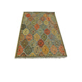 Handmade Afghan Aqcha Wool Rug 7x10 ft side angle view showing color variations across the kilim